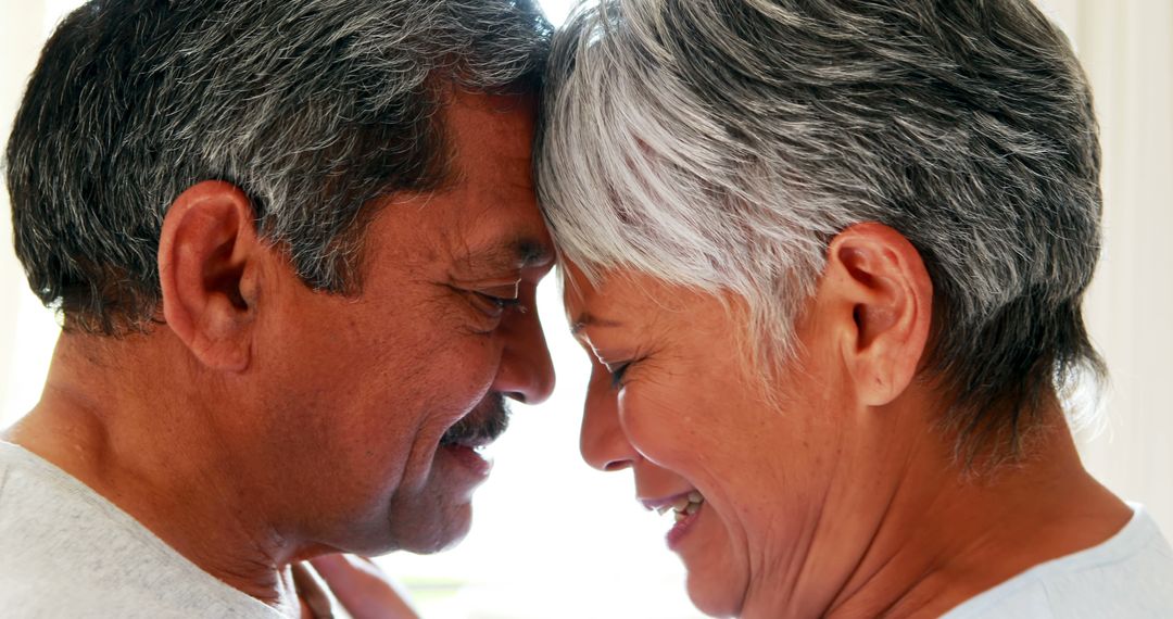 Elderly Couple Smiling and Sharing An Intimate Moment - Free Images, Stock Photos and Pictures on Pikwizard.com