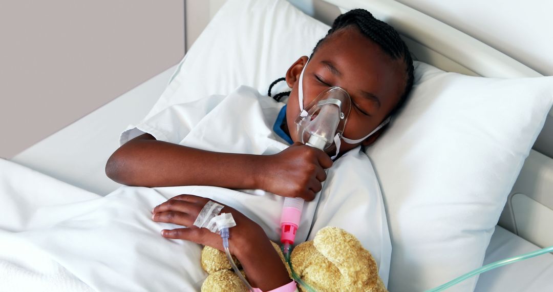 Young Patient Resting with Oxygen Mask in Hospital Bed - Free Images, Stock Photos and Pictures on Pikwizard.com