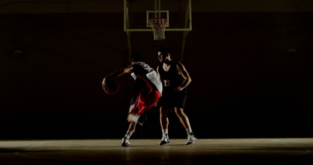 Dynamic Indoor Basketball Game Under Dramatic Lighting