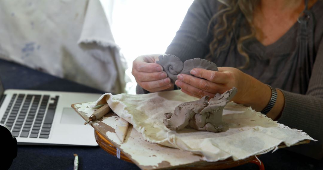 Female Artist Working with Clay in Home Studio - Free Images, Stock Photos and Pictures on Pikwizard.com