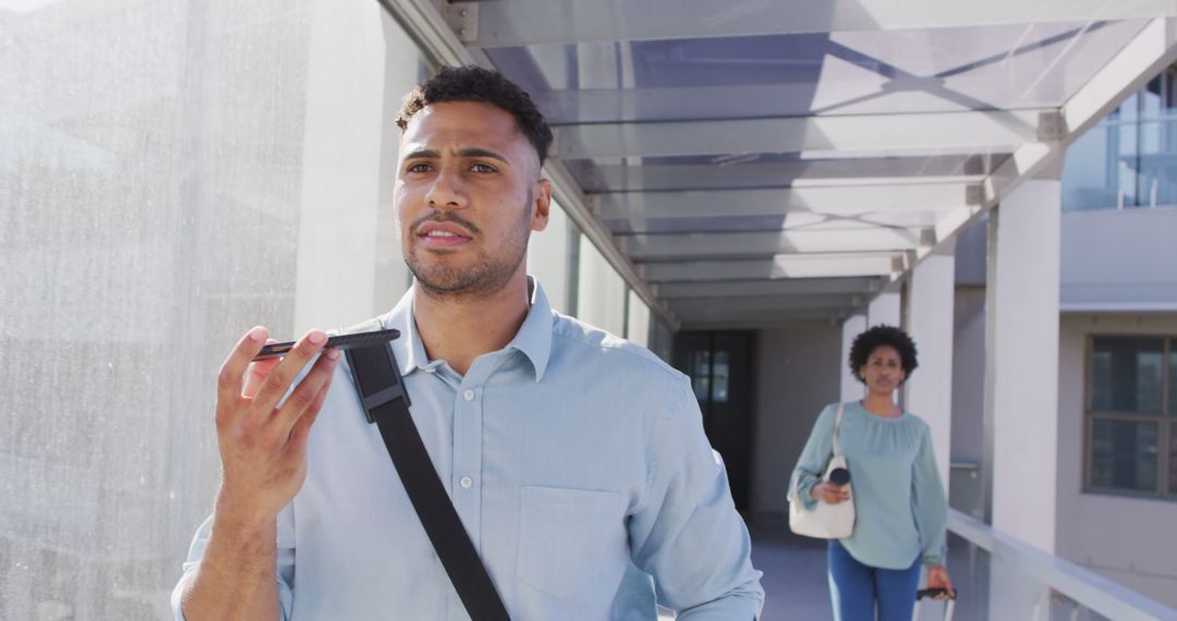 Man Walking and Using Voice Commands on Smartphone - Free Images, Stock Photos and Pictures on Pikwizard.com