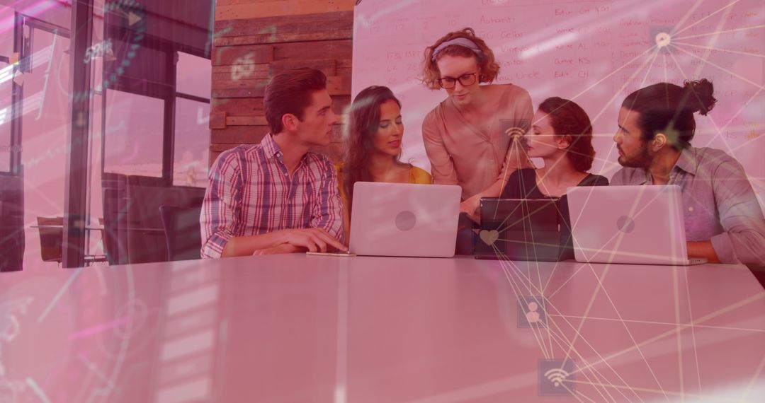 Diverse Team Discussing Digital Technology in Office Setting