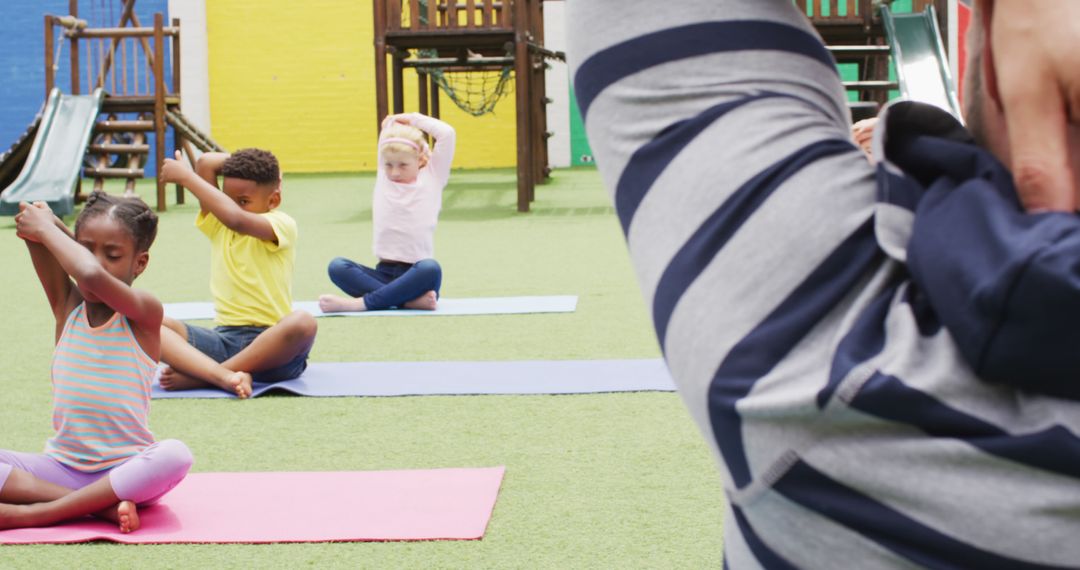 Children Practicing Yoga Outdoors in Playground Setting - Free Images, Stock Photos and Pictures on Pikwizard.com