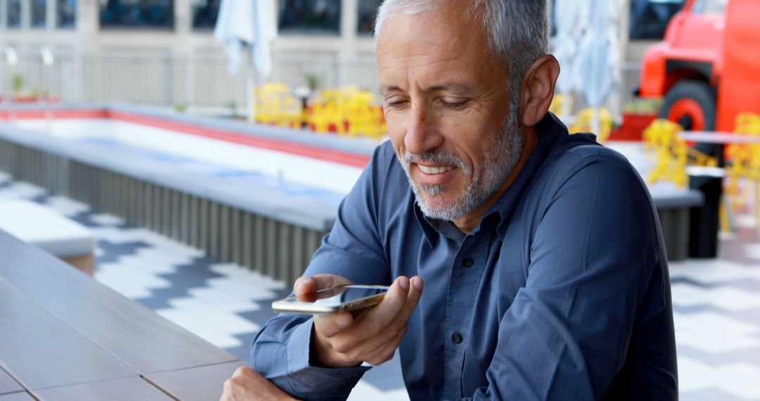 Senior Man Using Voice Command on Smartphone Outdoors - Free Images, Stock Photos and Pictures on Pikwizard.com