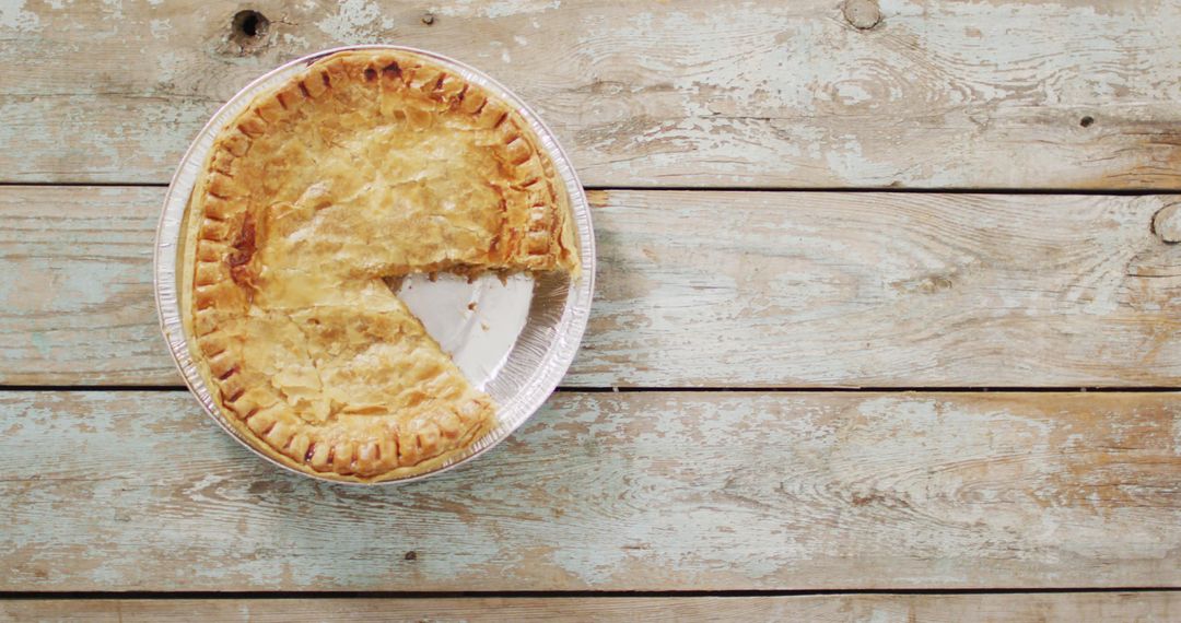 Rustic Apple Pie on Wooden Table with Missing Slice