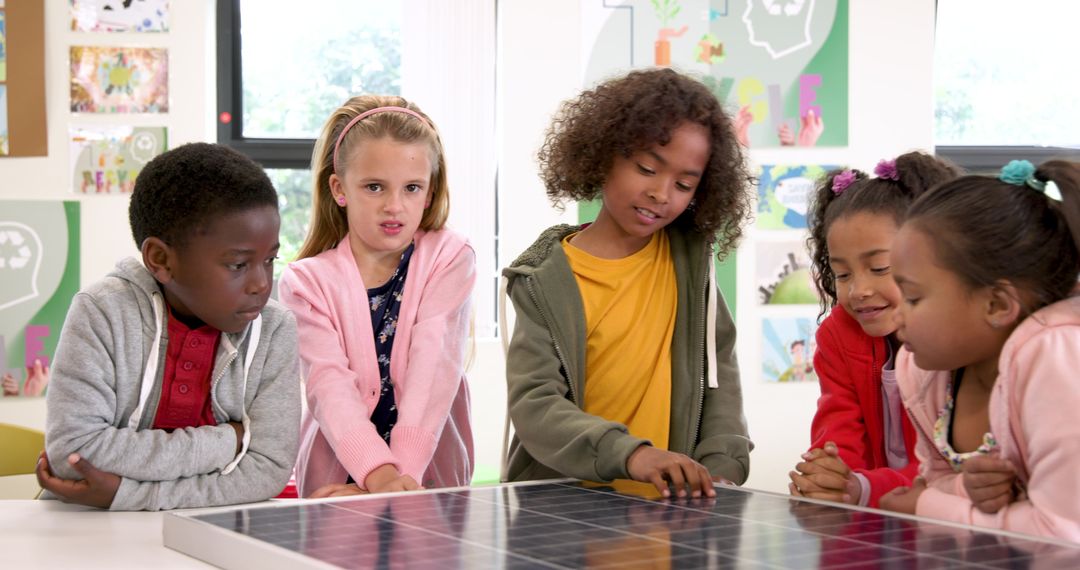 Diverse Children Collaborating on Solar Panel School Project