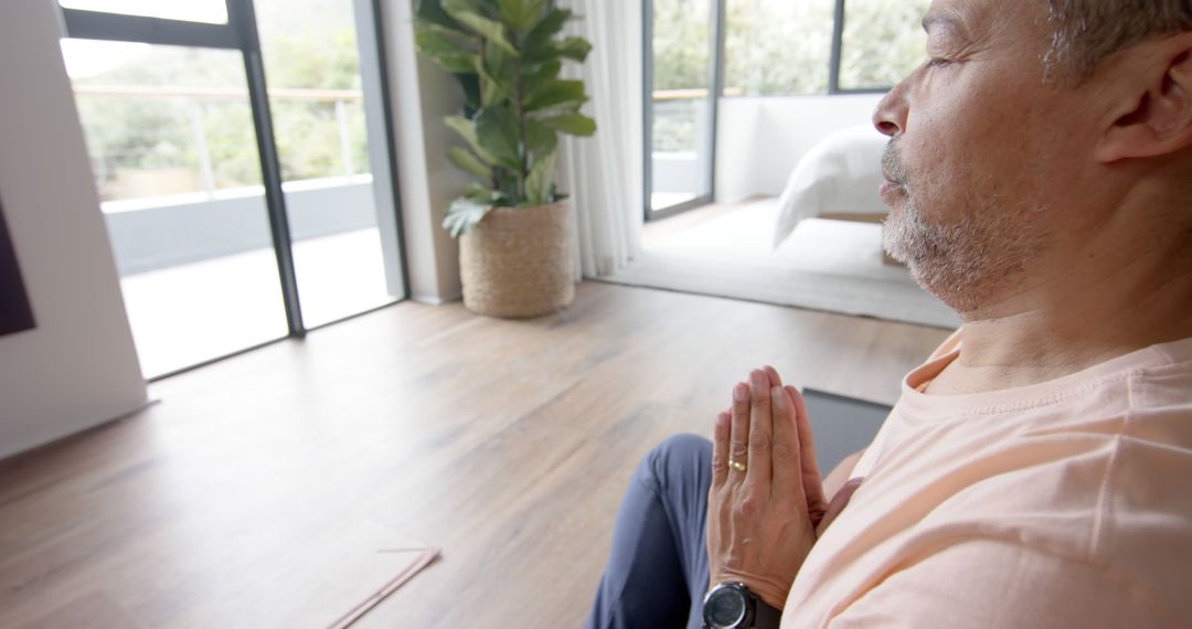 Senior Man in Peaceful Meditation Pose at Home - Free Images, Stock Photos and Pictures on Pikwizard.com