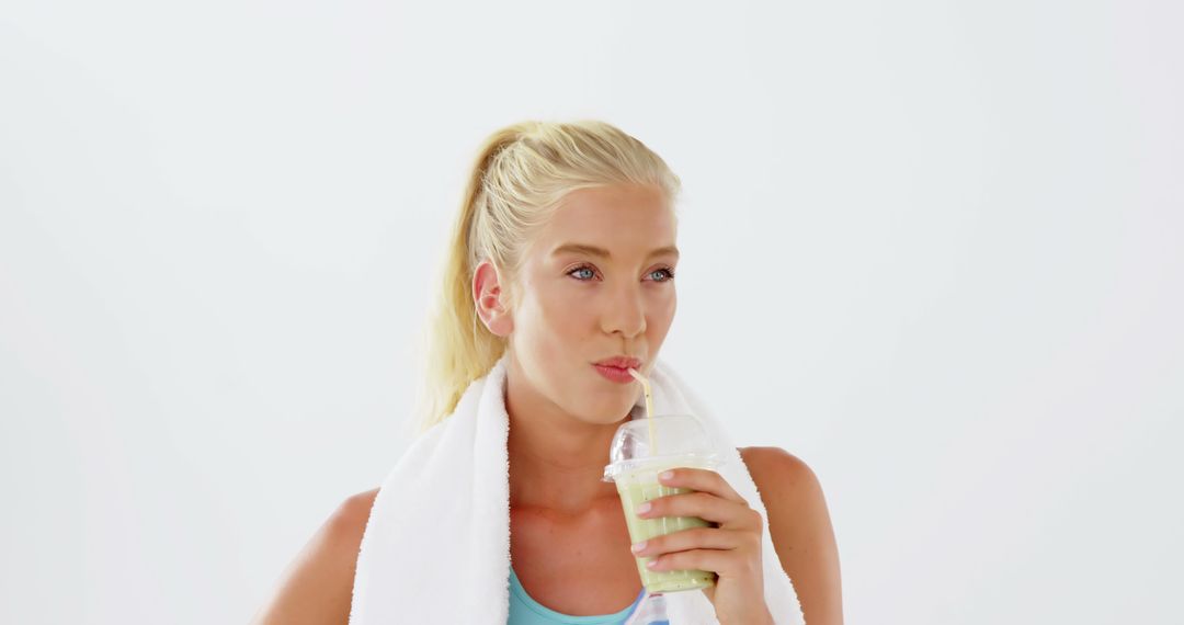 Blonde Woman Drinking Smoothie After Workout - Free Images, Stock Photos and Pictures on Pikwizard.com