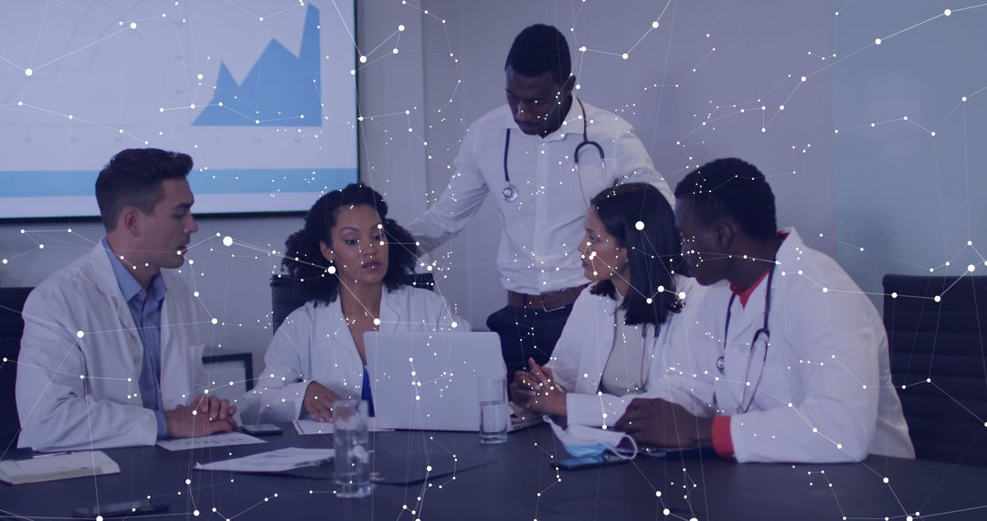 Diverse Medical Team Analyzing Data with Technology Overlay