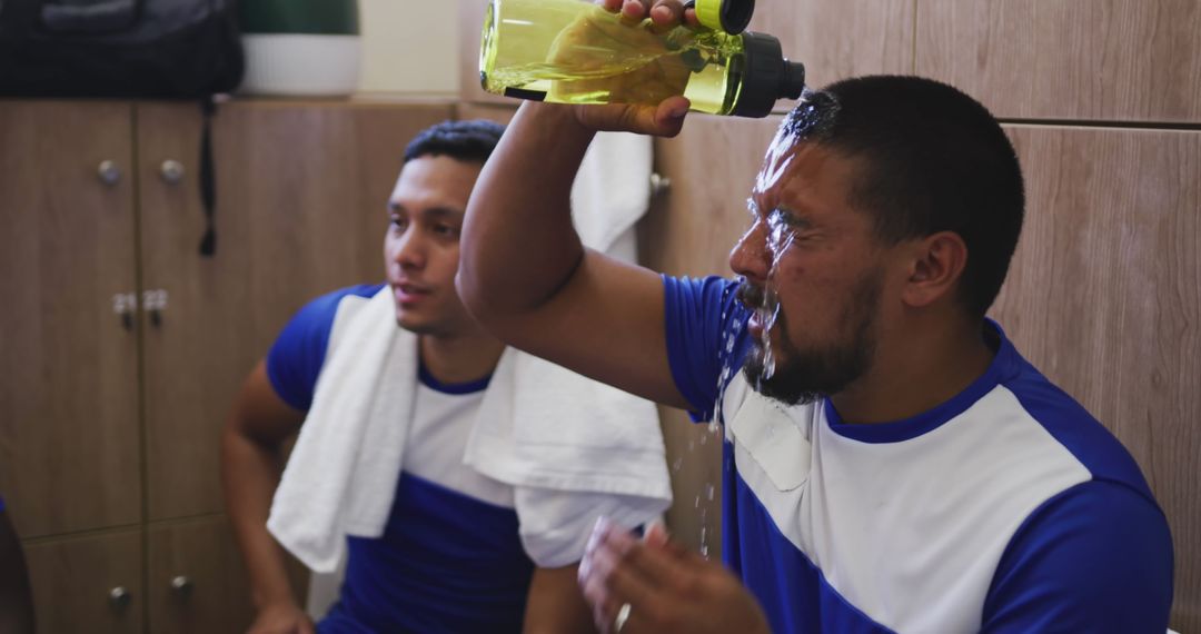 Hispanic Soccer Player Cooling Off in Locker Room Post-Match