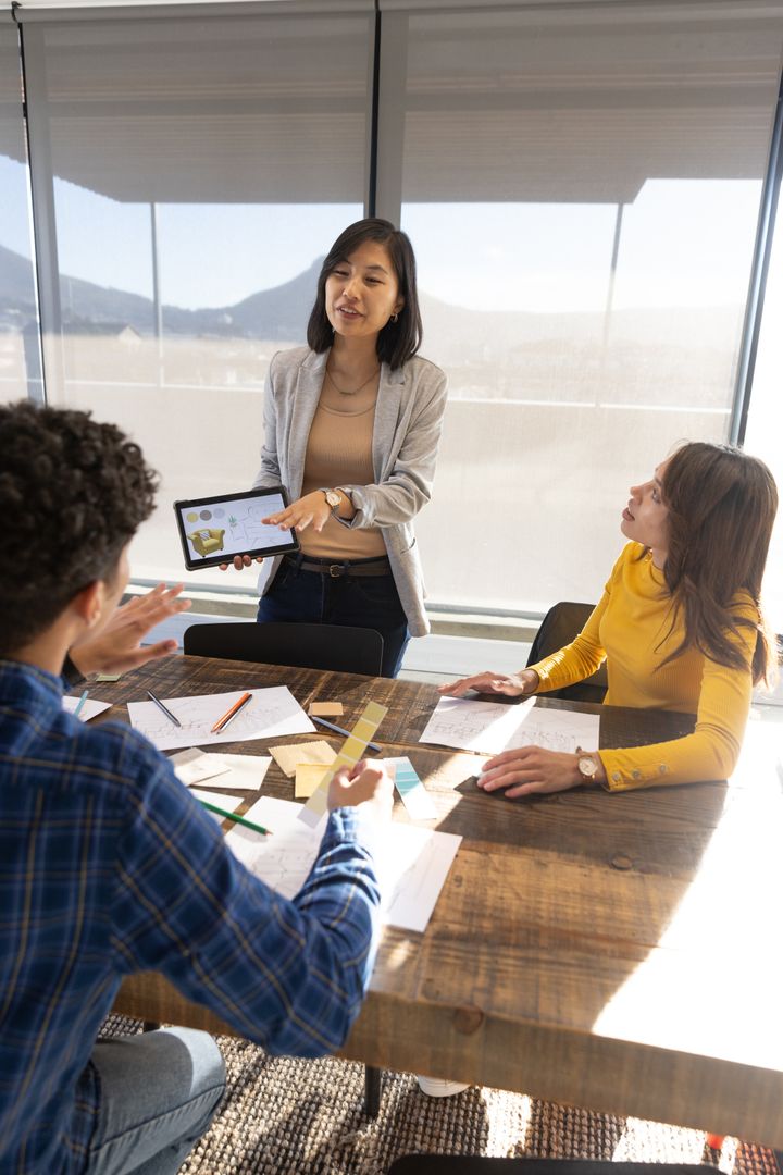 Diverse Multiethnic Team Discussing Business Data in Modern Office