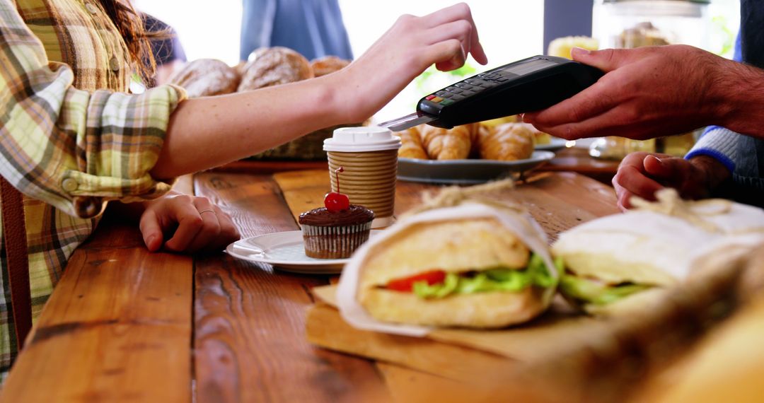 Customer Using Contactless Payment at Local Bakery - Free Images, Stock Photos and Pictures on Pikwizard.com