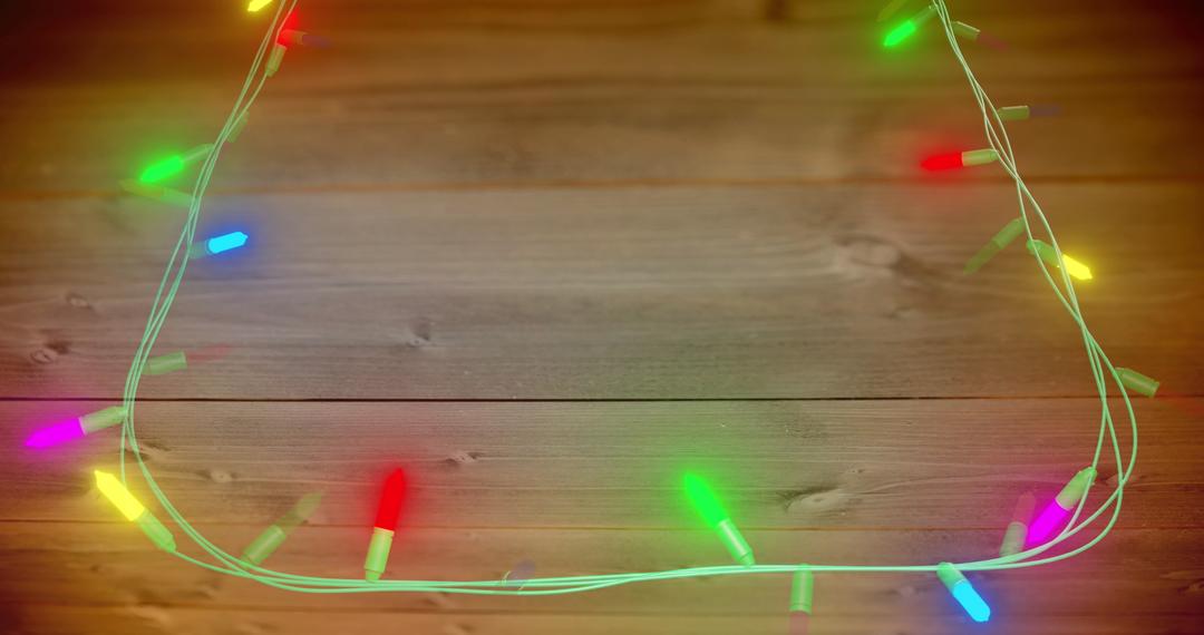 Colorful Fairy Lights on Wooden Background with Copy Space - Free Images, Stock Photos and Pictures on Pikwizard.com