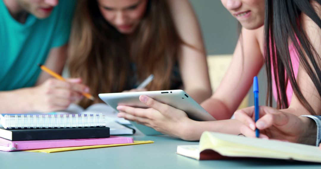 Group of Students Studying Together Using Tablet and Notebooks - Free Images, Stock Photos and Pictures on Pikwizard.com