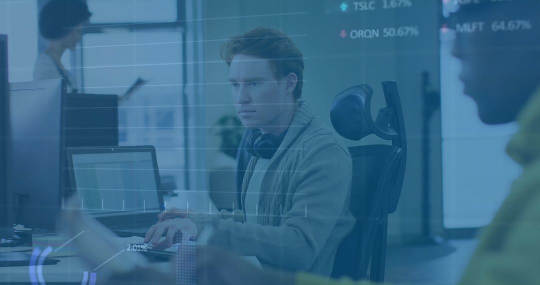 Focused Businessman Analyzing Financial Data in Modern Office