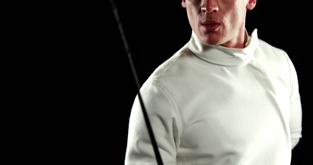 Man in Fencing Attire Holding Foil Ready for Match - Free Images, Stock Photos and Pictures on Pikwizard.com