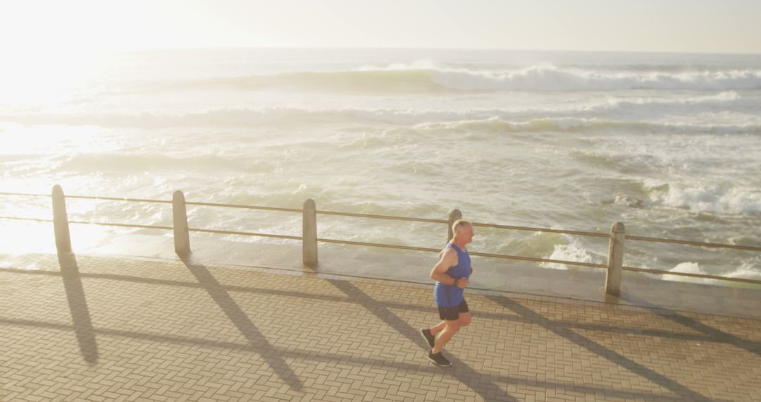Senior Man Running by the Seaside Promenade
