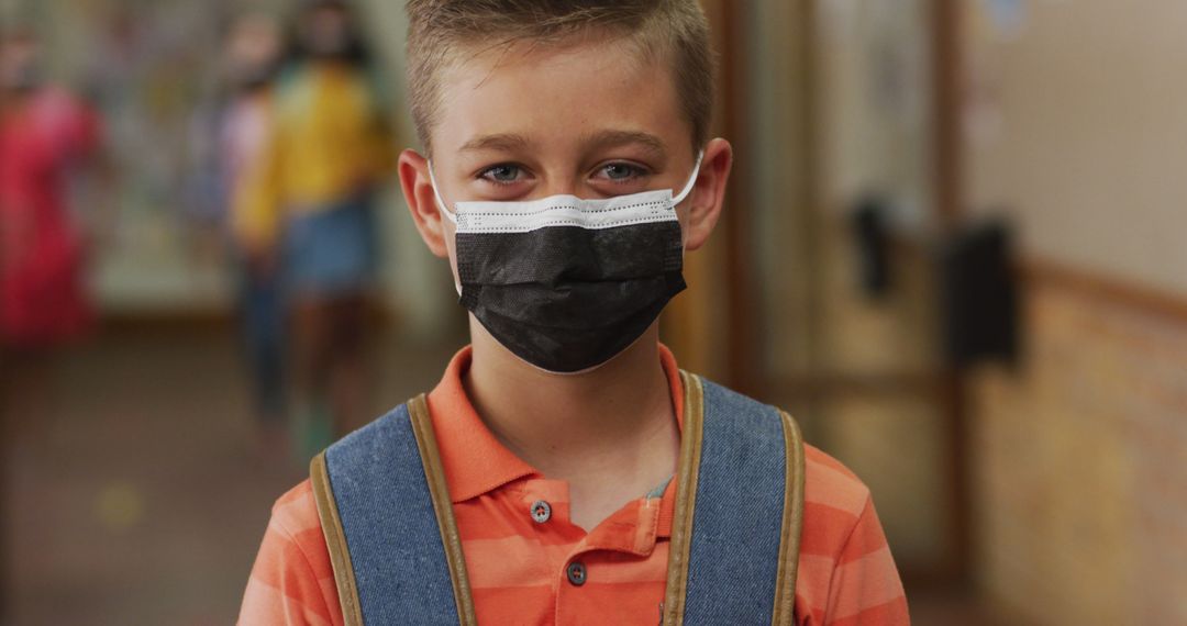 Schoolboy Wearing Face Mask in Corridor During Pandemic