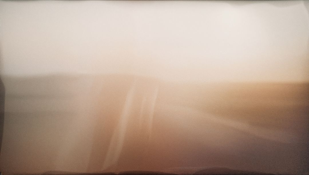 Warm Painterly Gradient Blur with Soft Horizontal Bands and Ambient Texture