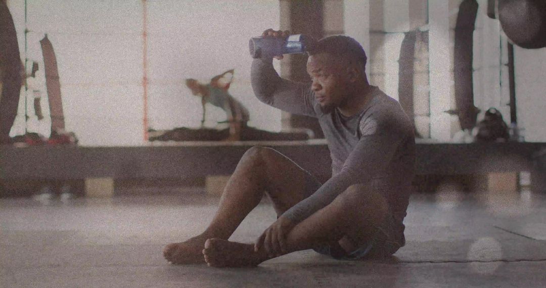 Athlete Cooling Down Relaxing in Gym Post-Workout