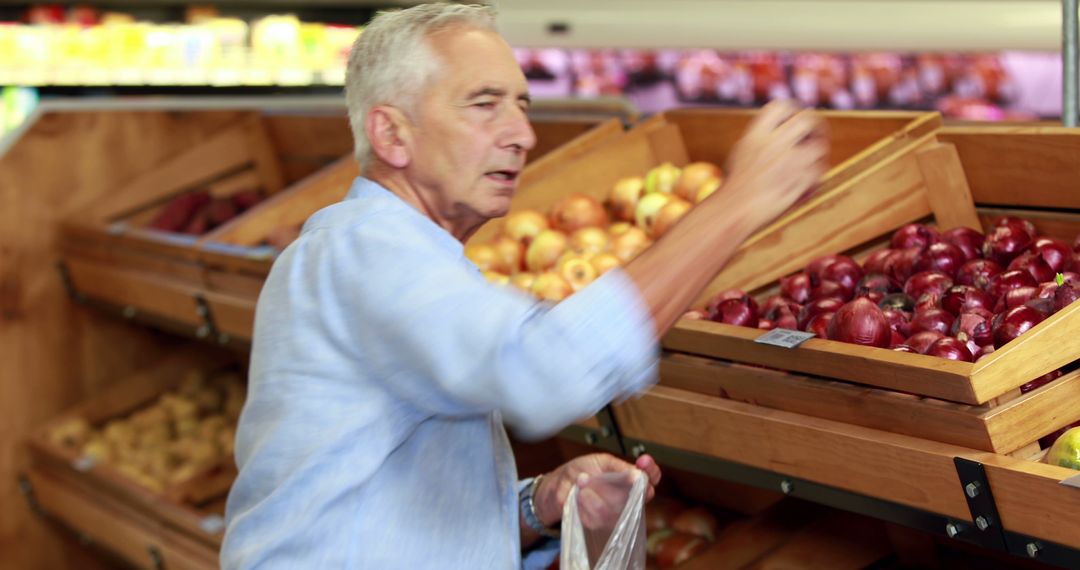 Senior Man Shopping for Fresh Produce at Supermarket - Free Images, Stock Photos and Pictures on Pikwizard.com