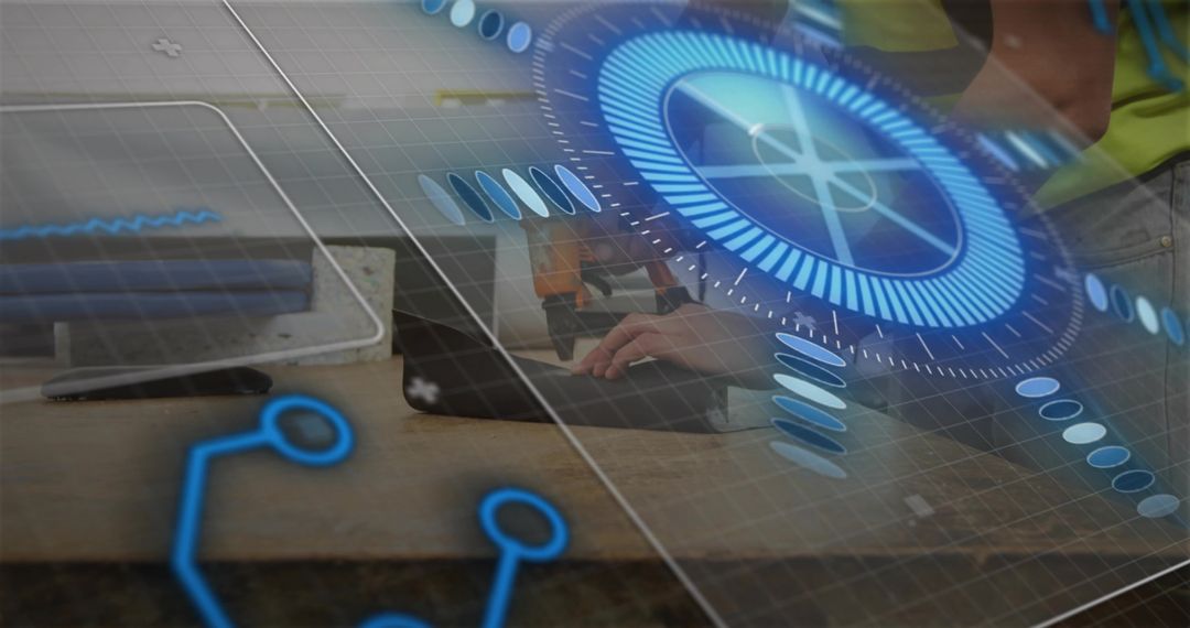 Engineers collaborating at workbench typing on laptop with AR interface overlay