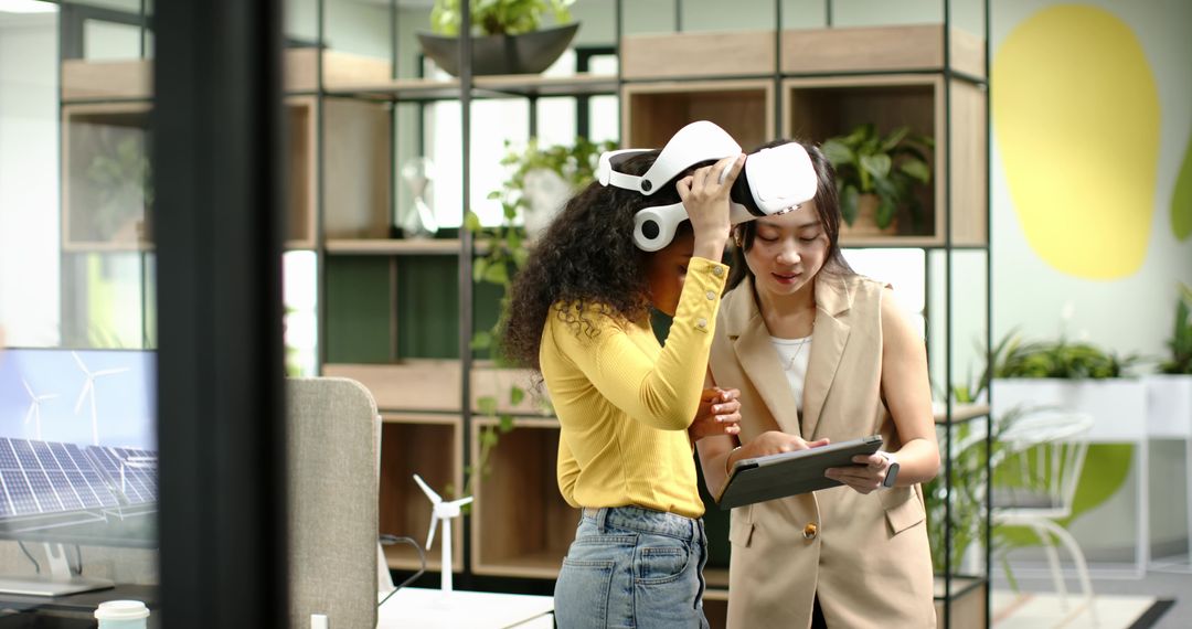 Diverse Coworkers Engaging with VR Technology in Modern Office