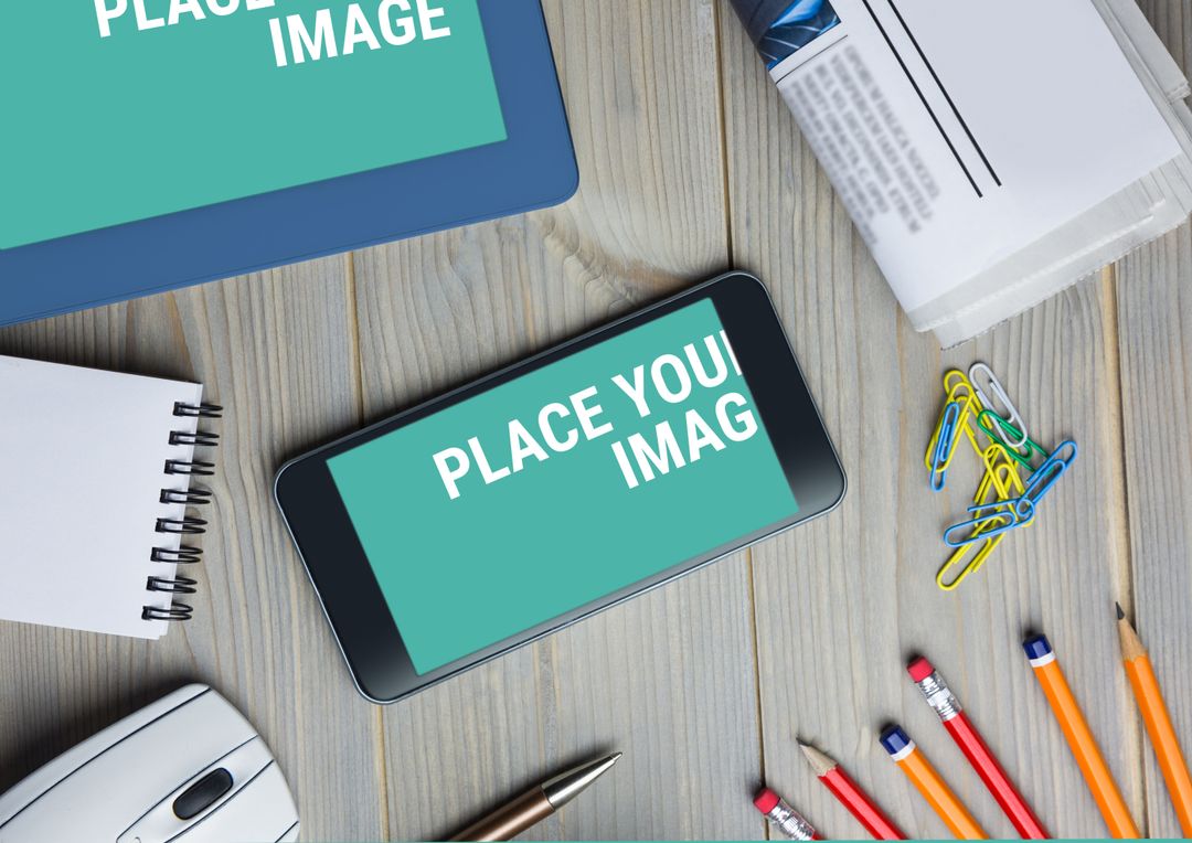 Workspace with Digital Devices and Office Supplies on Wooden Desk