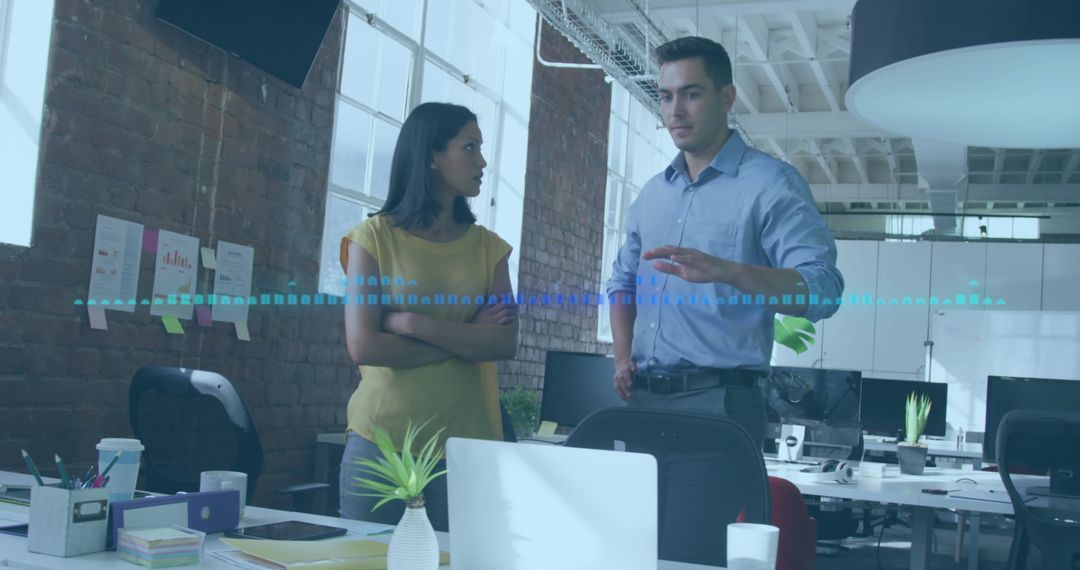 Diverse Colleagues Discussing Data in Modern Office