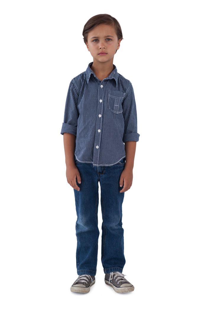 Boy standing against white background - Free Images, Stock Photos and Pictures on Pikwizard.com