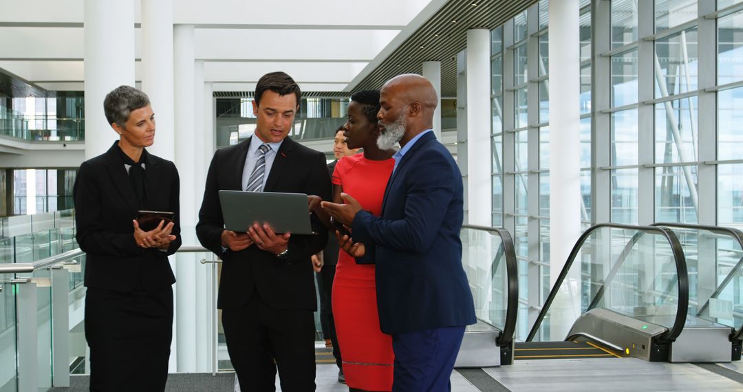 Diverse Team Collaborating in Modern Office with Technology