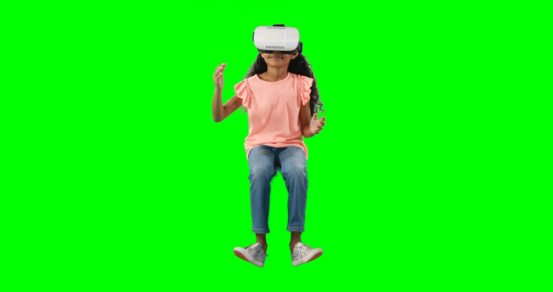 A young girl explores a digital realm with eager curiosity through her VR headset. - Free Images, Stock Photos and Pictures on Pikwizard.com