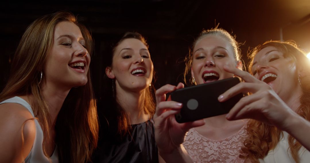 Group of Women Taking Selfie and Having Fun at Night Out - Free Images, Stock Photos and Pictures on Pikwizard.com