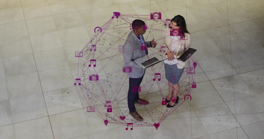 Business professionals collaborating inside glowing magenta network sphere with laptops