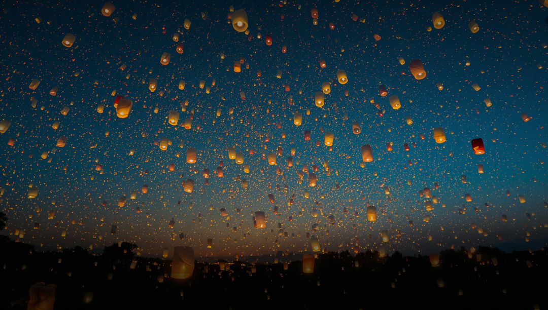 Illuminated Skylight Lanterns Floating During Night Festival