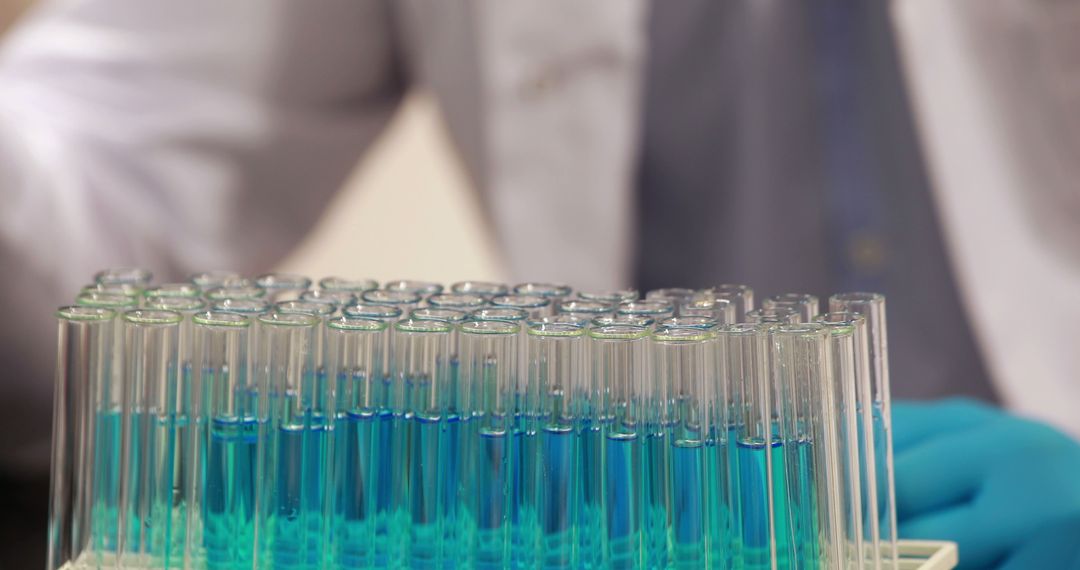 Scientist Working with Test Tubes in Laboratory - Free Images, Stock Photos and Pictures on Pikwizard.com