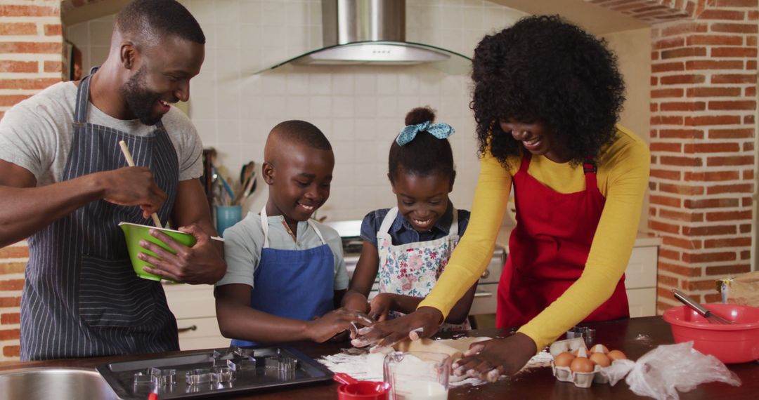 Happy African American Family Baking Together in Kitchen - Free Images, Stock Photos and Pictures on Pikwizard.com