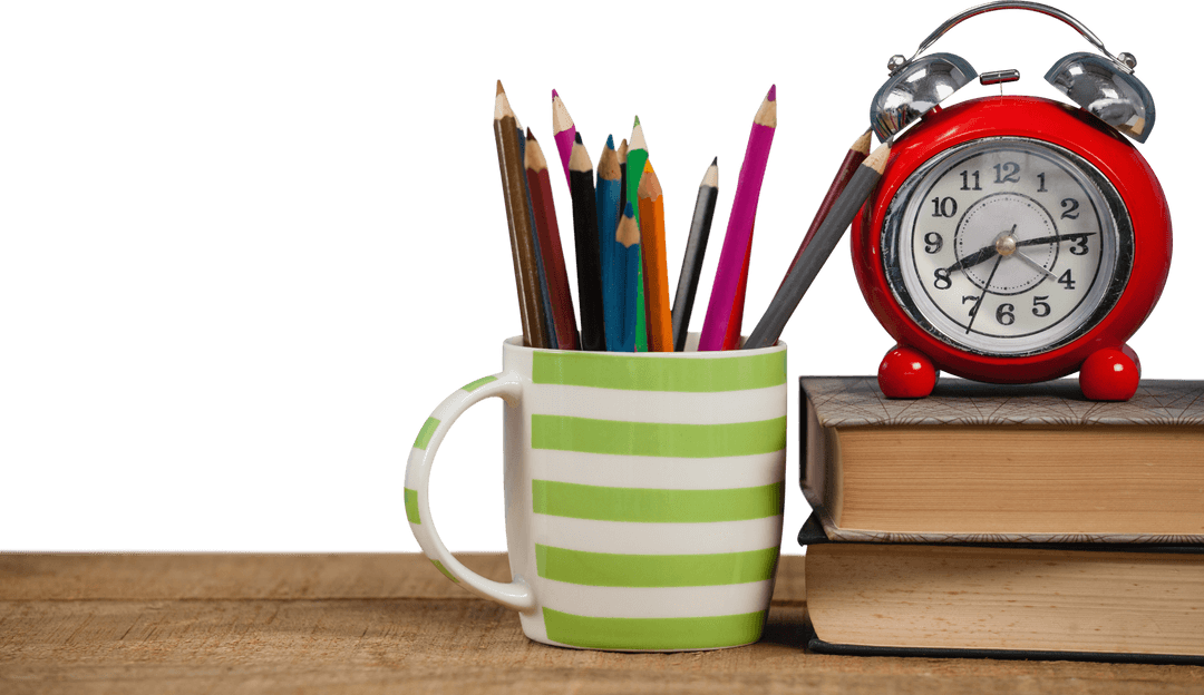 Transparent Striped Mug with Pencils and Red Alarm Clock
