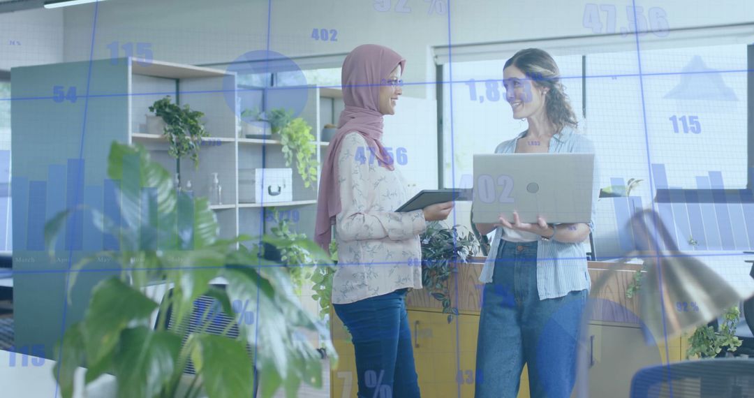 Diverse Professionals Analyzing Data in Modern Office