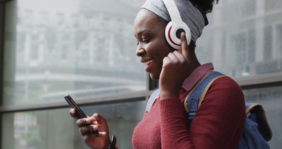 Woman Listening Music on Headphones with Smartphone - Free Images, Stock Photos and Pictures on Pikwizard.com