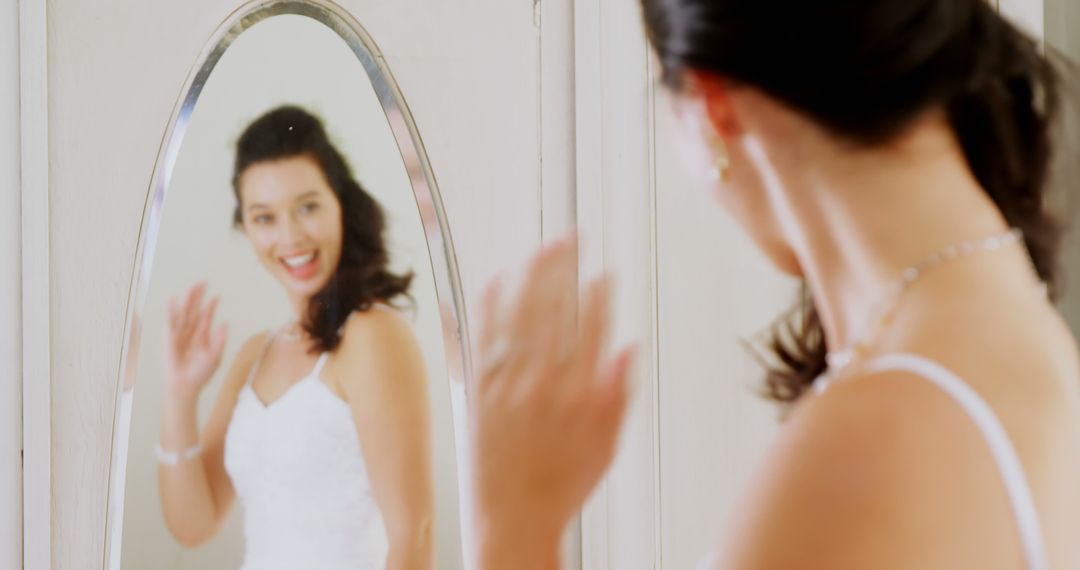 Joyful Bride in White Dress Admiring Reflection - Free Images, Stock Photos and Pictures on Pikwizard.com