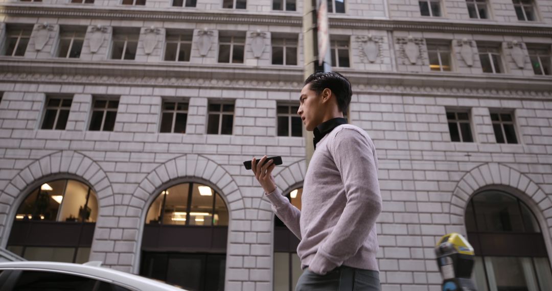 Businessman Walking in Modern City with Smartphone - Free Images, Stock Photos and Pictures on Pikwizard.com