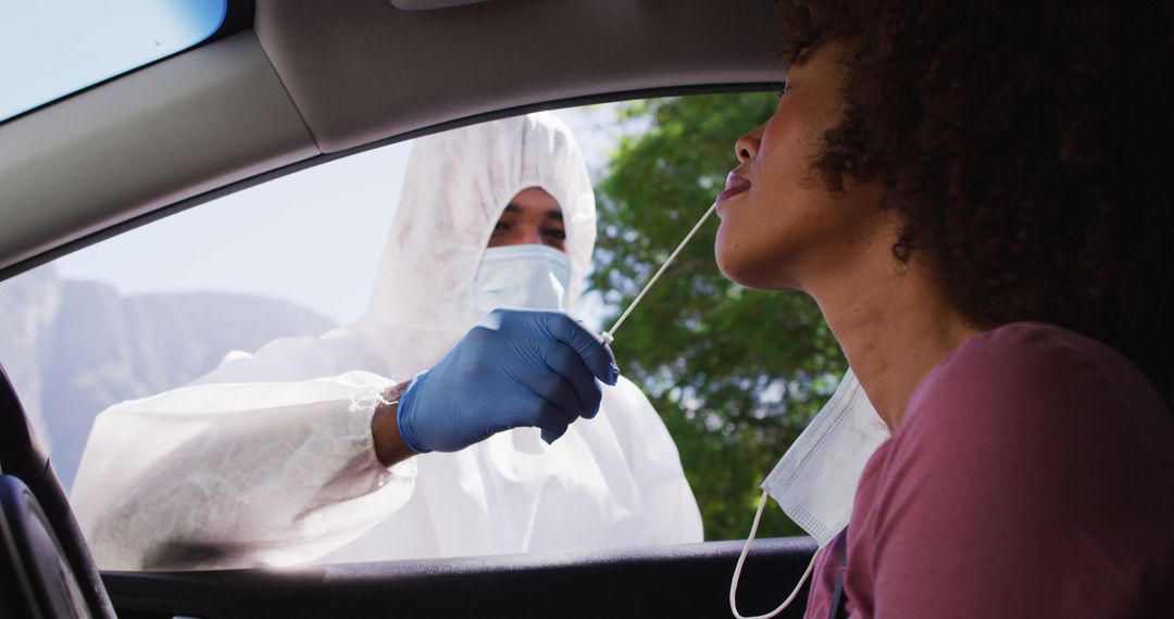 Healthcare Worker Performing COVID-19 Test on Woman in Car - Free Images, Stock Photos and Pictures on Pikwizard.com