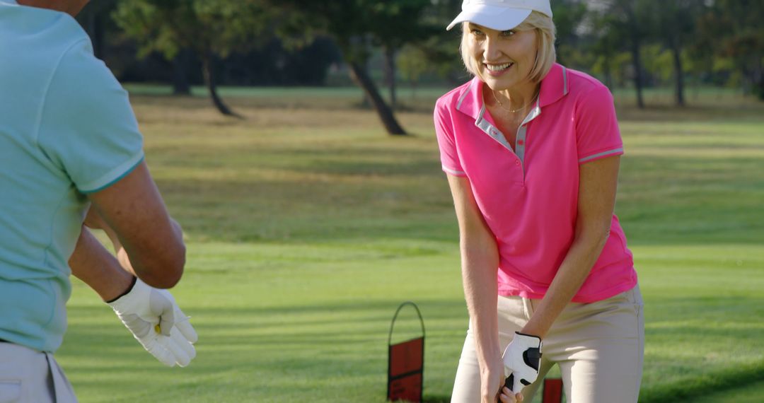 Senior Woman Playing Golf, Receiving Instructions from Coach on Golf Course - Free Images, Stock Photos and Pictures on Pikwizard.com