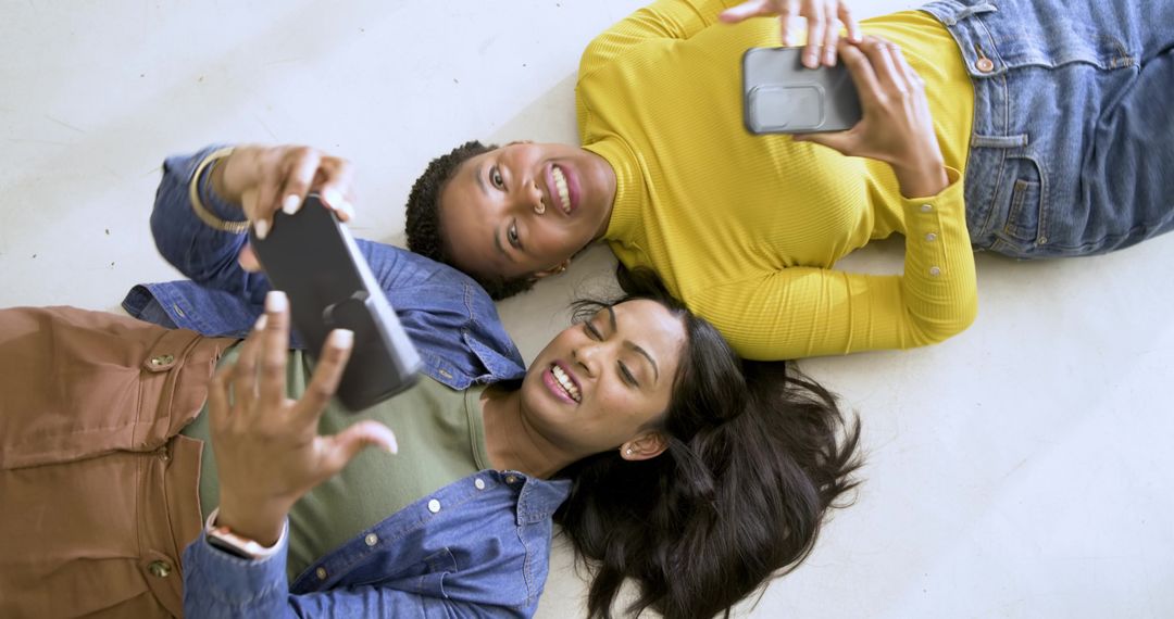 Diverse Friends Taking Selfie with Smartphones on Floor