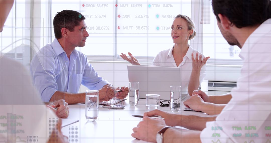 Business Team in Meeting Discussing Financial Data on Laptop - Free Images, Stock Photos and Pictures on Pikwizard.com