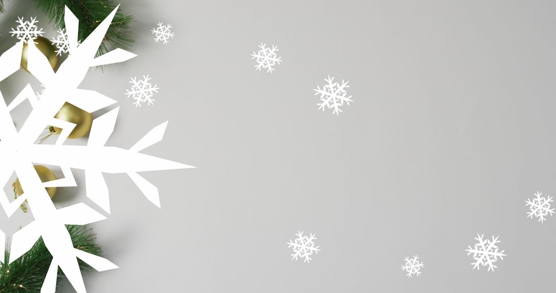 Elegant Snowflake Cutout with Pine Branches on Gray