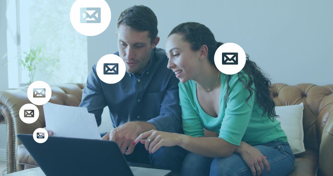 Couple Collaborating on Digital Technology with Envelope Icons
