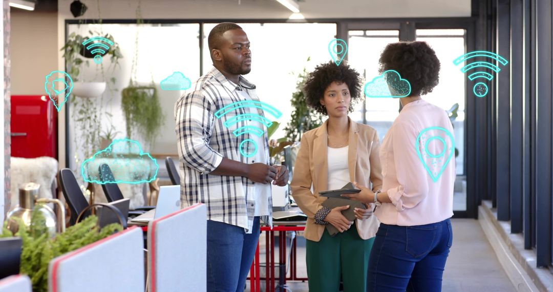 Team discussing cloud collaboration strategy using tablet in bright open-plan workspace