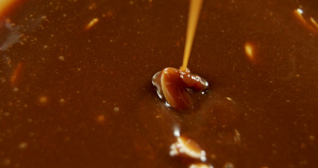 Rich Caramel Sauce Being Poured into Golden Brown Mix - Free Images, Stock Photos and Pictures on Pikwizard.com